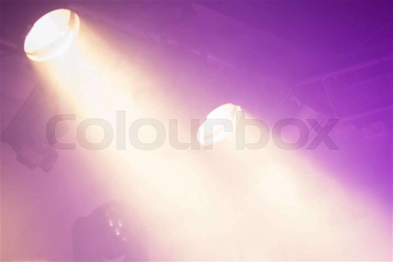 Powerful spot lights on purple background, stage illumination, stock photo