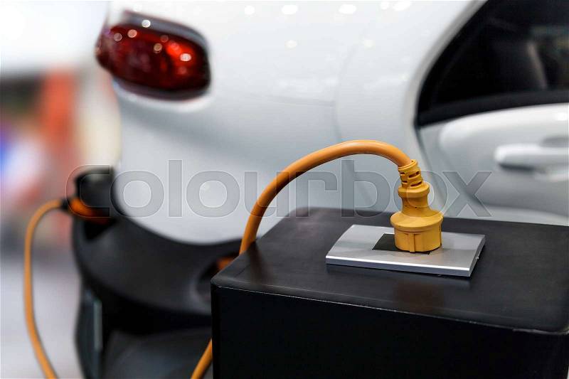 Charging an electric car, Future of transportation, stock photo