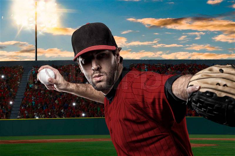 Baseball Player with a red uniform on baseball Stadium, stock photo