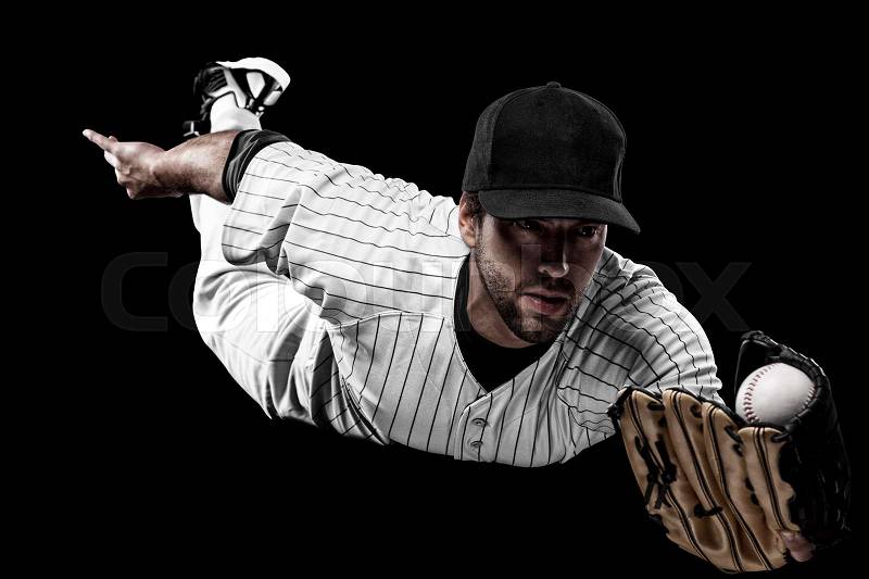 Baseball Player with a white uniform on a black background, stock photo