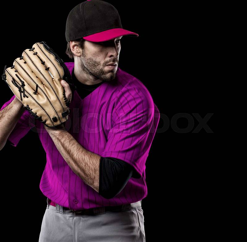 Pitcher Baseball Player with a pink uniform on a black background, stock photo