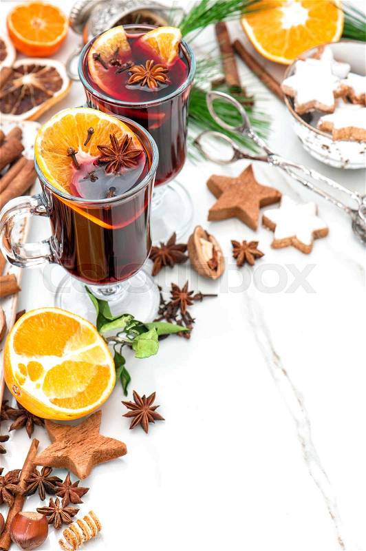 Mulled wine ingredients on bright background. Hot red punch with fruit and spices. Christmas food and drinks, stock photo