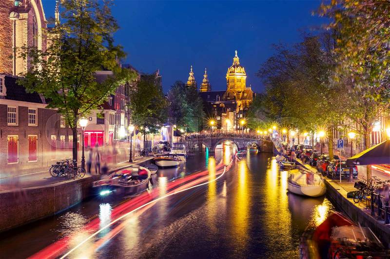 Night red-light district De Wallen, canal, Basilica of Saint Nicholas and bridge, Amsterdam, Holland, Netherlands. Long exposure. Used toning, stock photo
