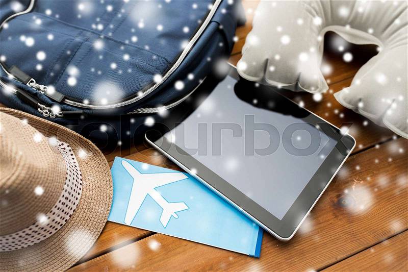 Vacation, travel, tourism, technology and objects concept - close up of tablet pc computer and traveler personal stuff, stock photo