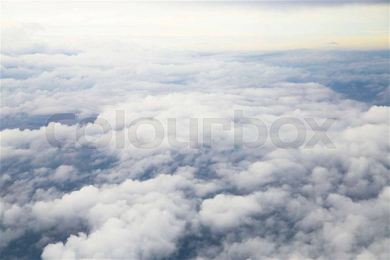 Closeup large gray clouds in the sky the view from the airplane window, stock photo