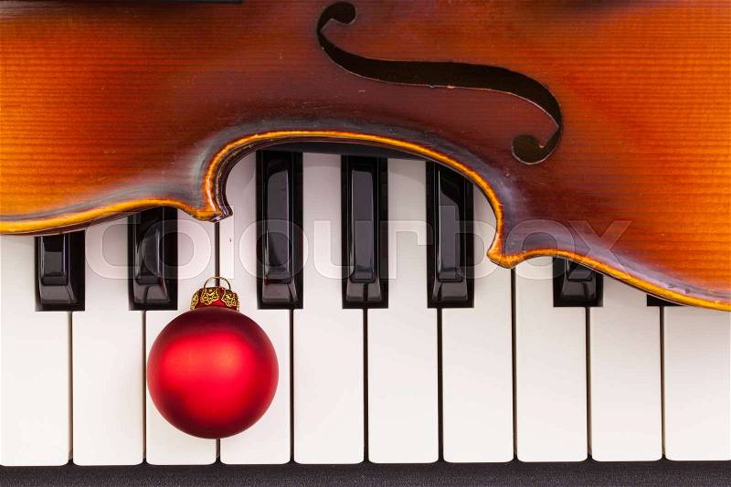 Top view close up shot of piano keyboard,old violin and Christmas decoration. Flat Lay Image, stock photo
