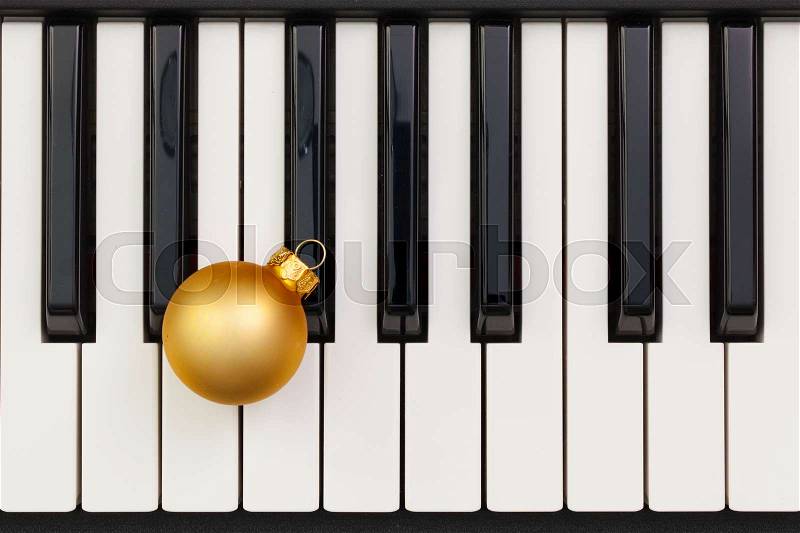 Top view close up shot of piano keyboard and Christmas decoration. Flat Lay Image, stock photo