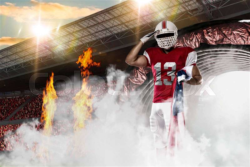 Football Player with a red uniform coming out of a stadium tunnel, stock photo