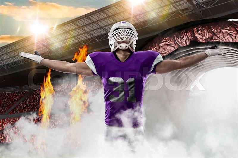 Football Player with a purple uniform coming out of a stadium tunnel, stock photo