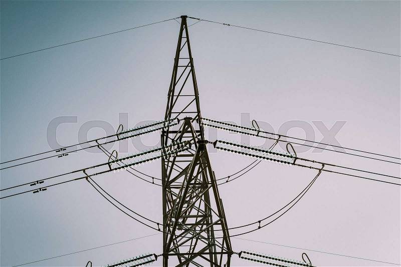 High-voltage tower on a grey sky of background, stock photo