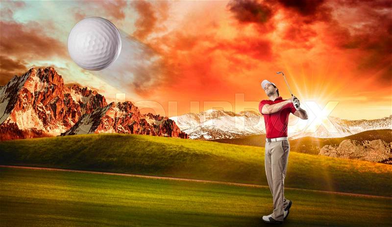 Golf Player in a red shirt taking a swing, on a golf course, stock photo
