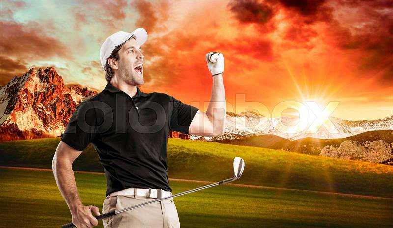 Golf Player in a black shirt celebrating, on a golf course, stock photo