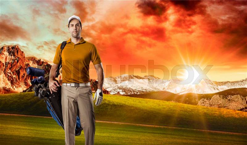 Golf Player in a orange shirt walking with a bag of golf clubs on his back, on a golf course, stock photo