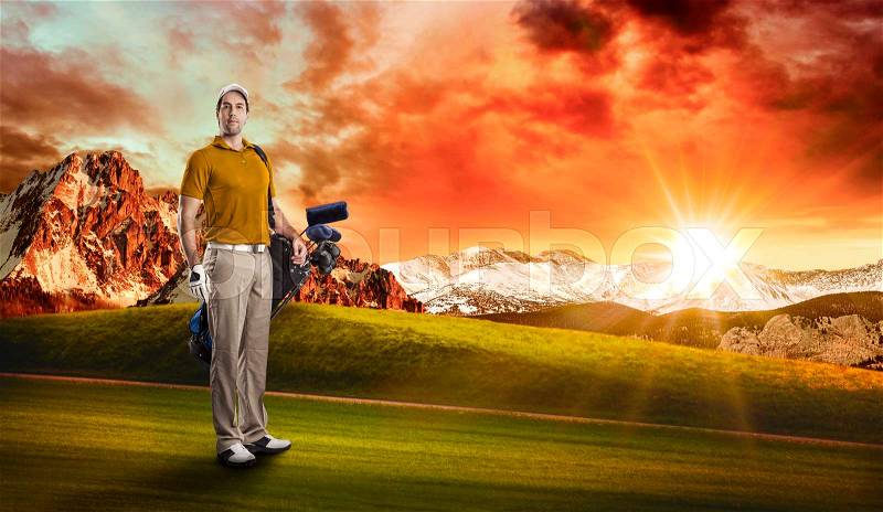 Golf Player in a orange shirt, standing with a bag of golf clubs on his back, on a golf course, stock photo