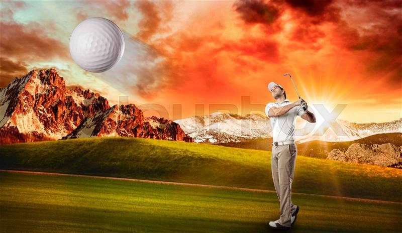 Golf Player in a white shirt taking a swing, on a golf course, stock photo
