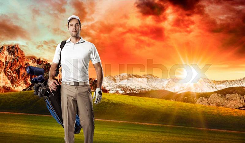 Golf Player in a white shirt walking with a bag of golf clubs on his back, on a golf course, stock photo