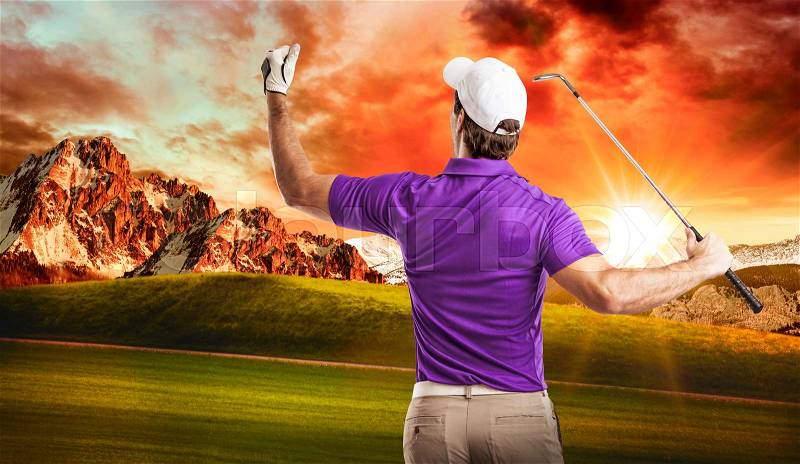 Golf Player in a purple shirt celebrating, on a golf course, stock photo