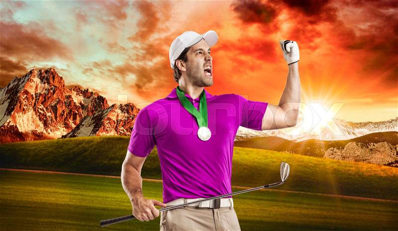 Golf Player in a pink shirt celebrating with a golden medal, on a golf course, stock photo