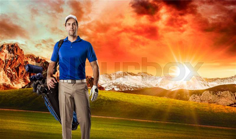 Golf Player in a blue shirt walking with a bag of golf clubs on his back, on a golf course, stock photo
