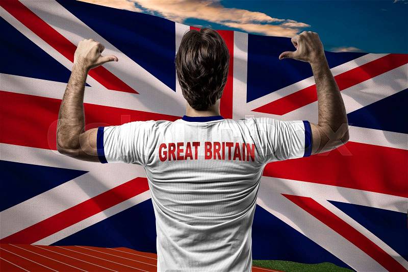 British Athlete Winning a golden medal in front of a British flag, stock photo