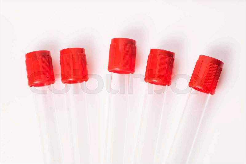 Five test tubes for blood samples with red cap, isolated, stock photo