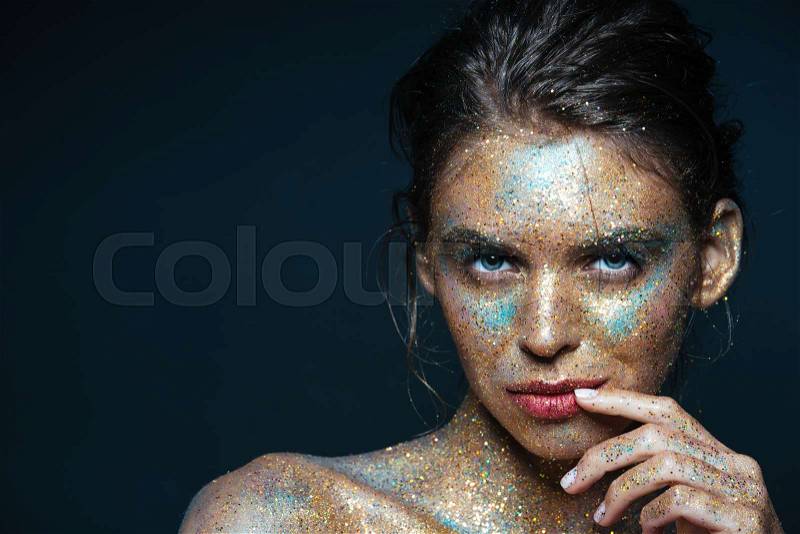 Beauty portrait of attractive young woman with shining bright makeup, stock photo