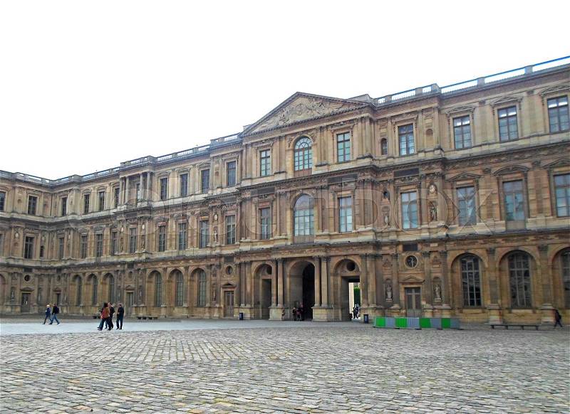 The famous square courtyard building of the Louvre Museum. May 2013, France, stock photo