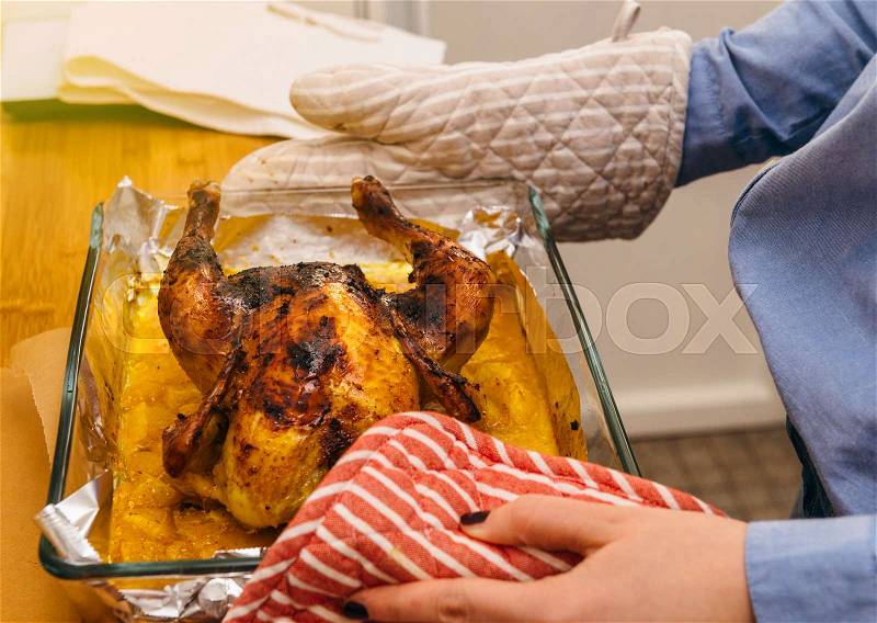 Delicious roast chicken directly from oven made under special Swedish recipe with ginger, oranges, apples and other organic food ingredients - ready to be served, stock photo