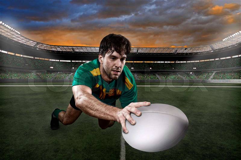 Rugby player in a green and gold uniform on a stadium, stock photo
