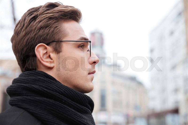 Business man in glasses in profile on the street, stock photo