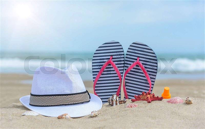 Flip-flops and shells on the beach. Summer Still Life, stock photo
