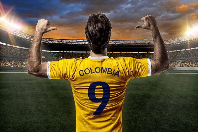 Colombian soccer player, celebrating on a stadium, stock photo