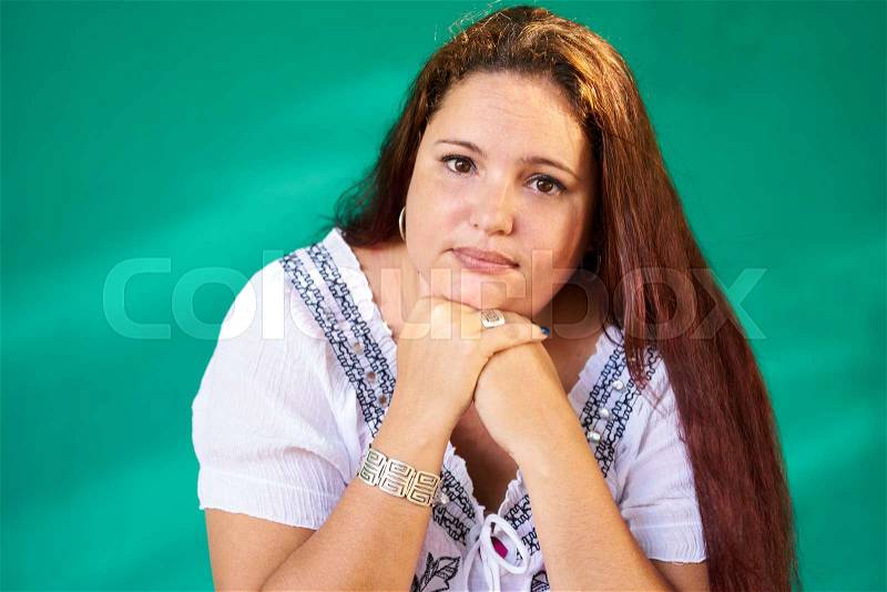 Cuban people and emotions, portrait of sad overweight latina looking at camera. Depressed fat hispanic young woman from Havana, Cuba, stock photo
