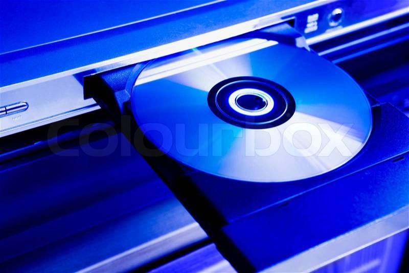 DVD disc on the tray of a dvd-player, stock photo