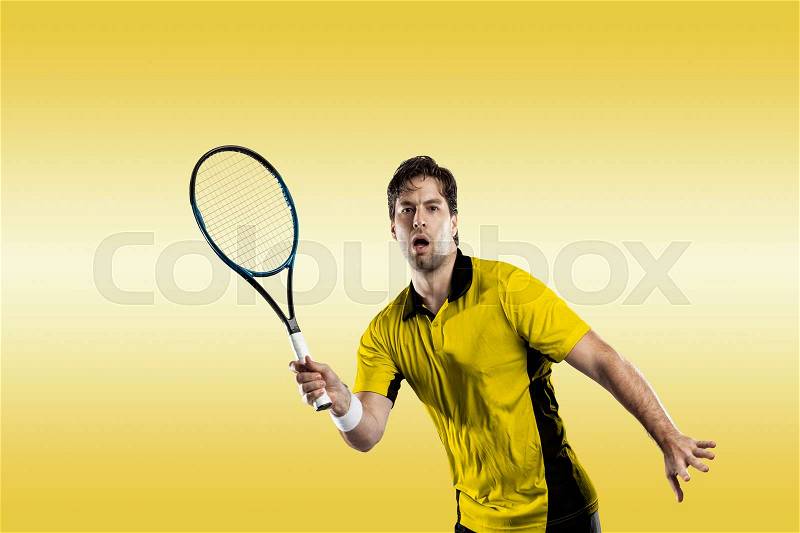 Tennis player with a yellow shirt, playing on yellow background, stock photo