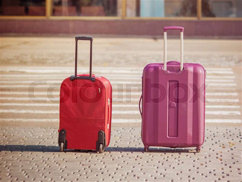 Plastic travel suitcases in the airport hall, stock photo