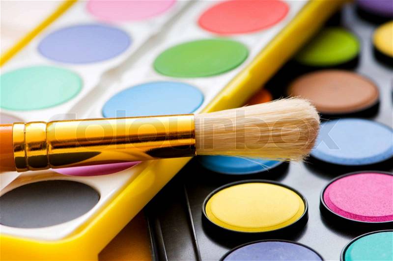 Art concept with painters palette and paint brush, stock photo
