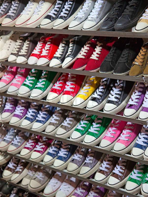 Lots of sneaker shoes on sale on Hong Kong night market, stock photo