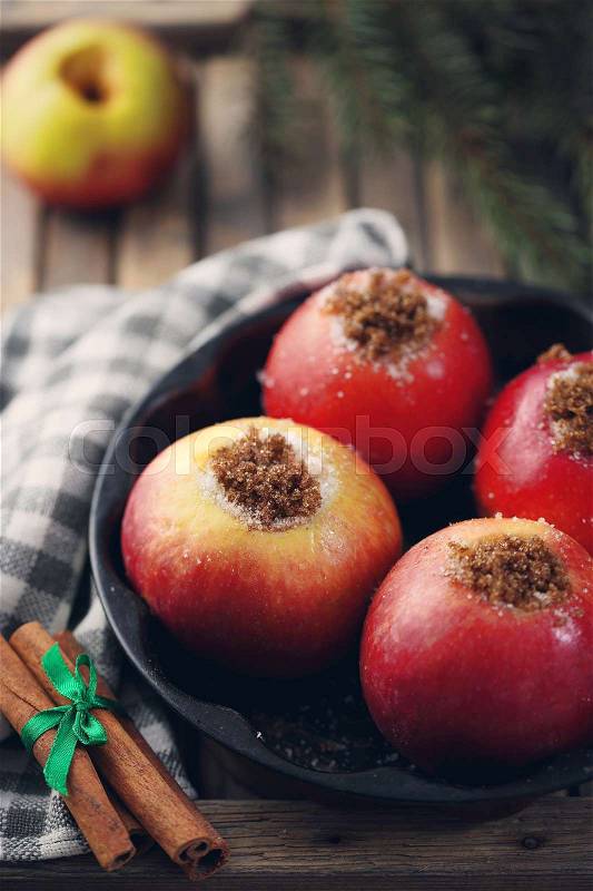 Apples with cinnamon and cane sugar. Winter dessert, stock photo