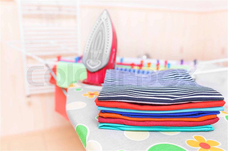 Ironed clothes on an ironing board. Close-up, stock photo