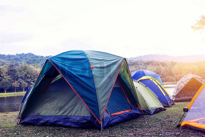 Tent camp of tourism at the river, stock photo