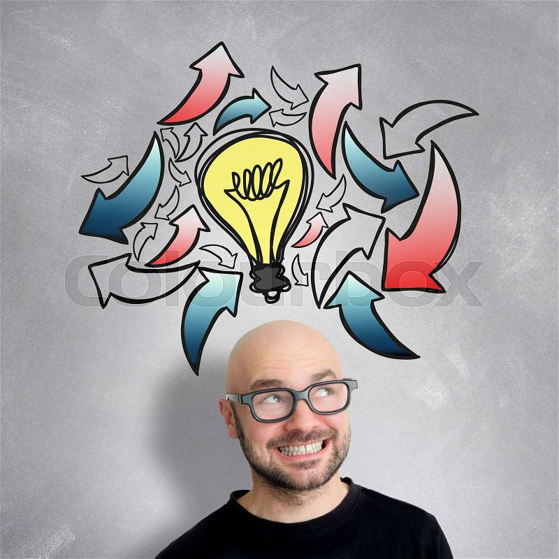 View of a Young attractive smiling geek man with brainstormaing arrow over the head, stock photo