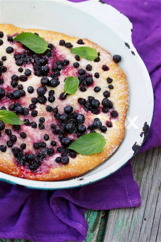 Pies with blueberries and mint, top view, stock photo
