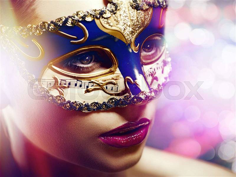 Carnival. Fantastic female portrait with shine light and beauty bokeh, stock photo