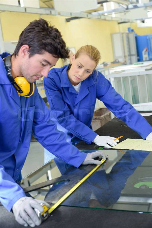 Young qualified people forced to work at the factory, stock photo