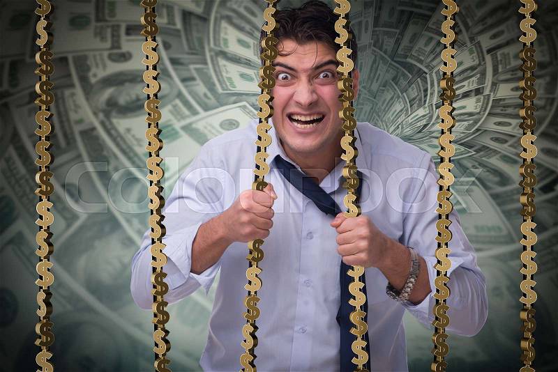 Man trapped in prison with dollars, stock photo