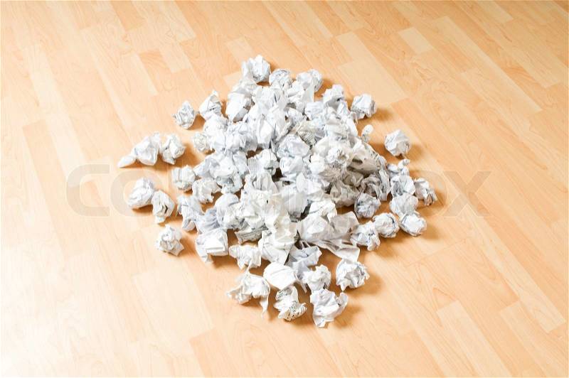 Lots of garbage paper on the wooden floor, stock photo