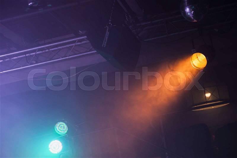 Spot lights over dark ceiling background, rock music concert stage illumination equipment, stock photo