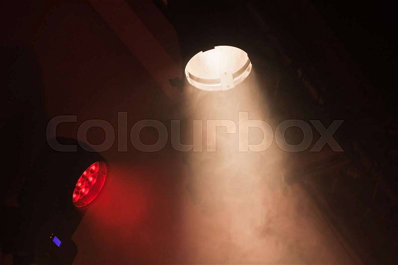Stage spot lights with smoke in beams, stage illumination equipment, stock photo