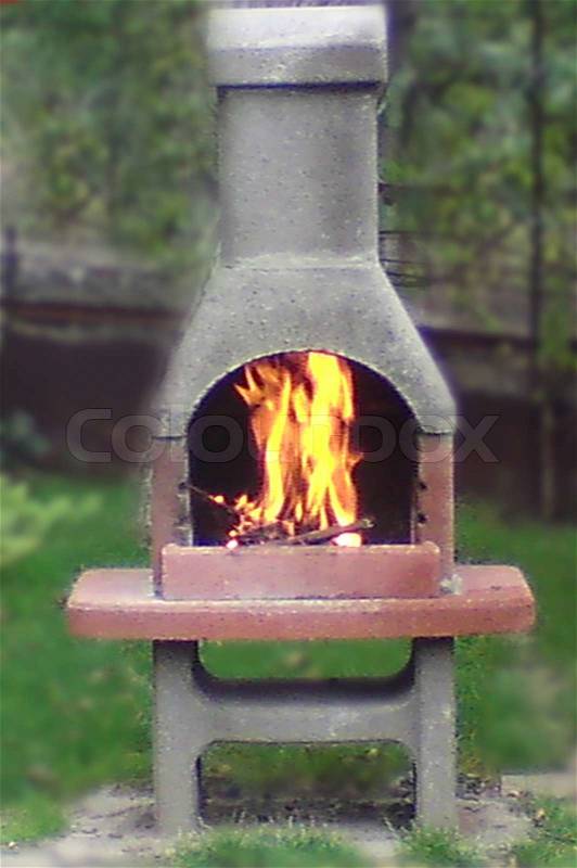 Bright fire burns in a fireplace, stock photo